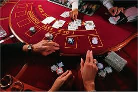 kuningtoto slot Baccarat dealer operating live table with camera setup
